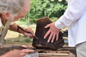 Dr Stuart Needham looks at a Bronze Age burial urn excavated at Petersfield Heath